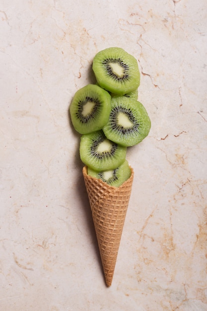 Premium Photo Kiwi With Ice Cream Cone 