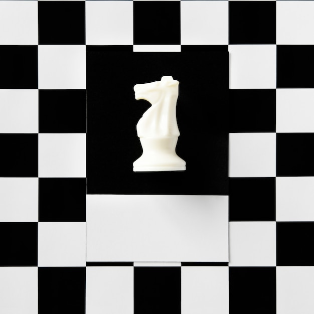 Knight chess piece on a pattern | Free Photo