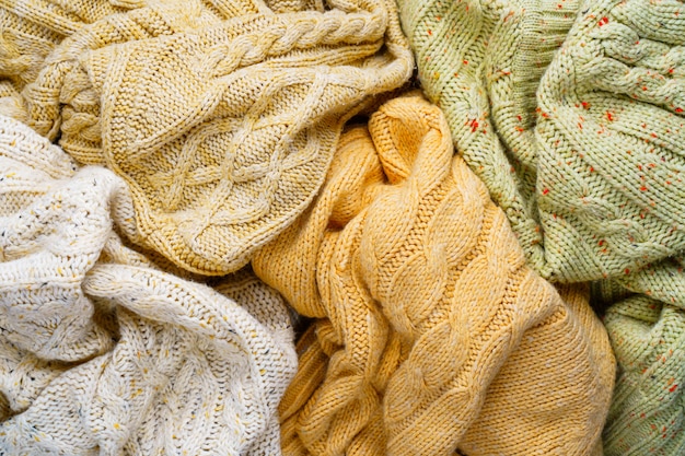 Premium Photo | Knitted sweaters background