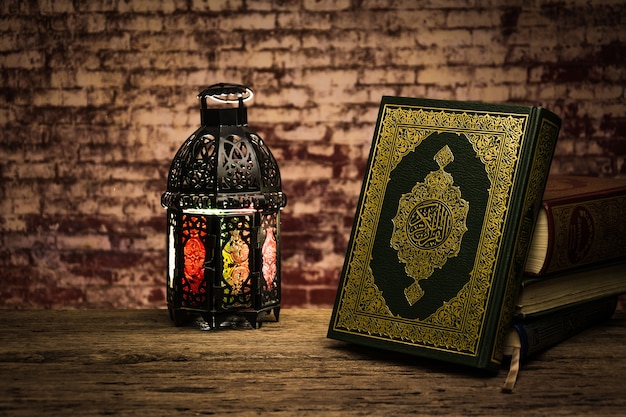 Koran - holy book of muslims ( public item of all muslims ) on the table , still life Premium Photo