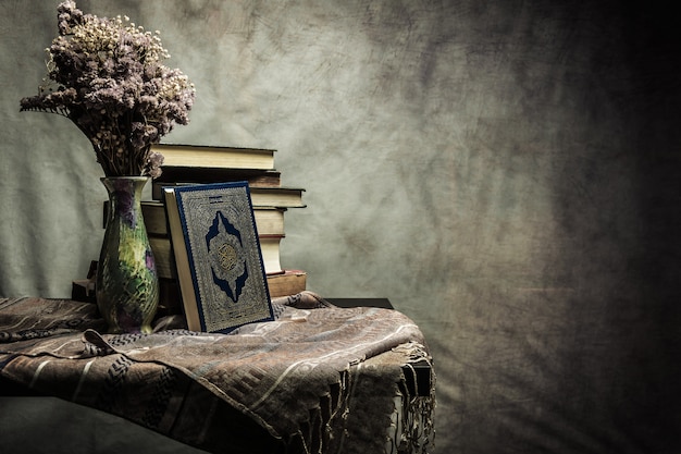 Koran - holy book of muslims ( public item of all muslims ) on the table , still life Premium Photo