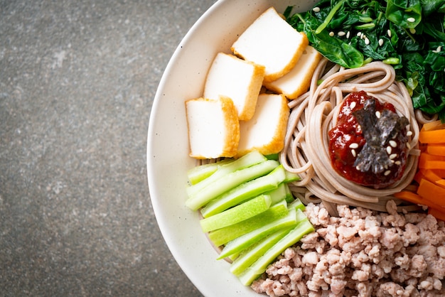 Premium Photo Korean Spicy Cold Noodles Bibim Makguksu Or Bibim