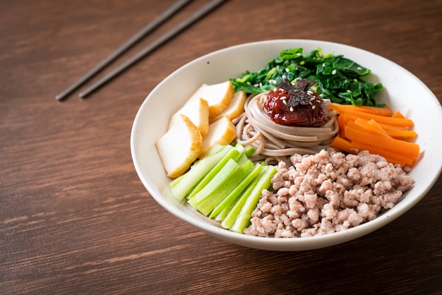 Premium Photo Korean Spicy Cold Noodles Bibim Makguksu Or Bibim