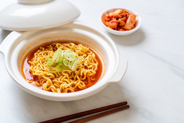 Premium Photo | Korean spicy instant noodles with kimchi