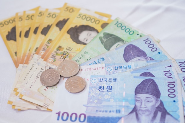 Premium Photo | Korean won notes and Korean won coins for money   