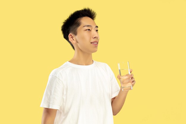 Free Photo Korean Young Man S Half Length Portrait On Yellow Wall