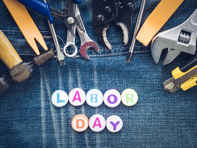 Premium Photo Labor Day Background Concept Many Handy Tools With Labor Day Text On Jeans Background