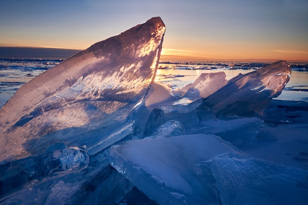 Premium Photo | Lake baikal at sunset, everything is covered with ice ...