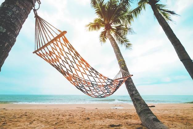 Download Premium Photo | Landscape of hammock with coconut palm tree on tropical beach in summer. summer ...