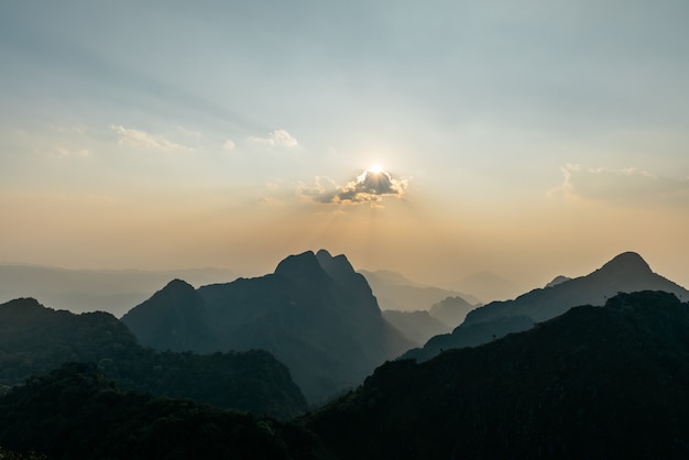 Premium Photo | Landscape of mountains, clouds with sunrays at dusk