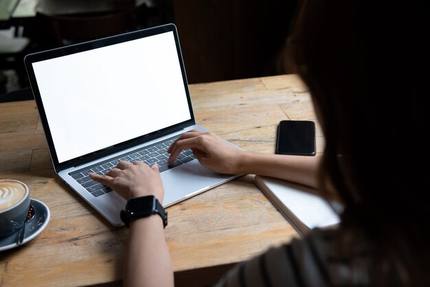 Laptop screen template.blank laptop display presentation mock up.hands at work with laptop. Premium Photo