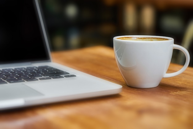 Premium Photo | Laptop with coffee