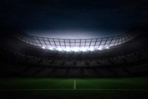 Large football stadium under night sky | Premium Photo