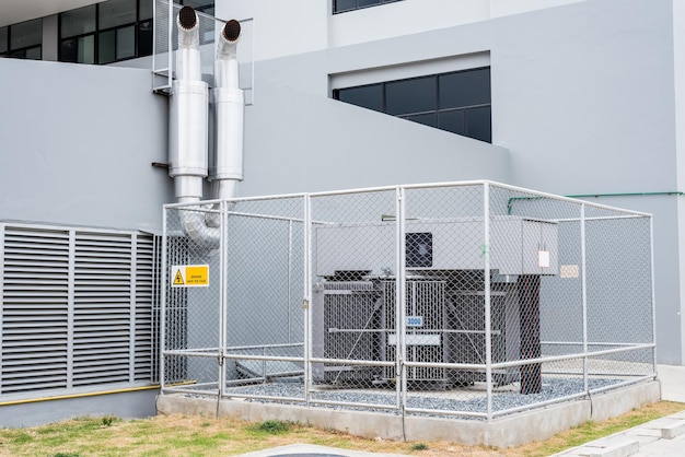 Premium Photo | Large power transformers are installed outside the building