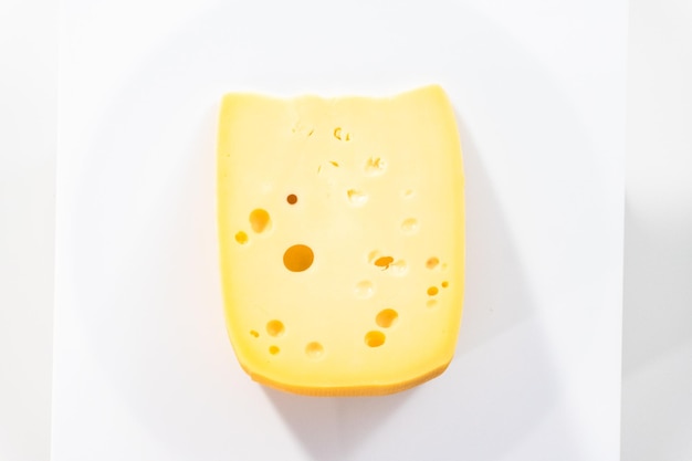 Premium Photo | Large Slice Of Semi Soft Part Skim Cheese On A White ...