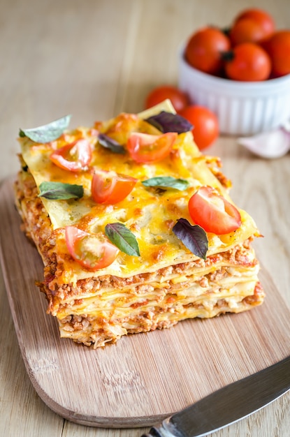 Premium Photo | Lasagna with cherry tomatoes