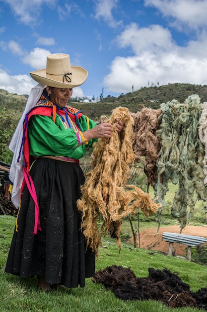 Premium Photo Latin American Andean Mother Drying Colored Wool For