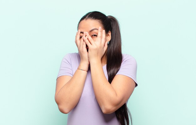 afraid-and-confused-scared-latin-woman-white-background-by-stockland