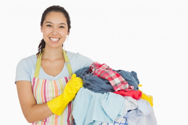 Laughing woman holding  laundry  basket  Photo Premium Download