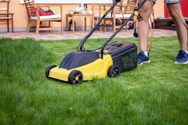 Premium Photo | Lawn mower in the garden