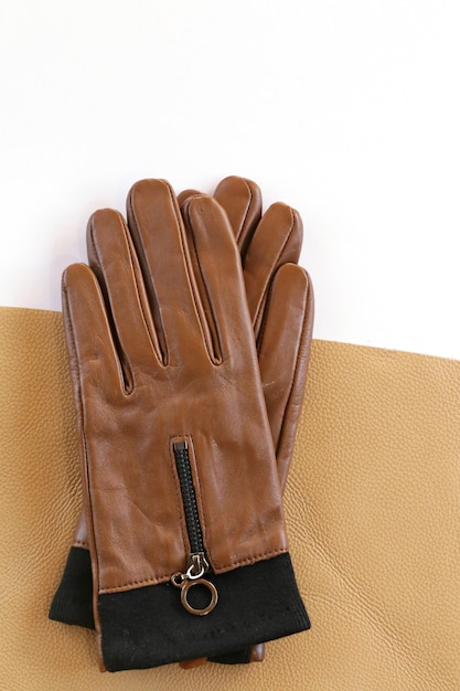 Premium Photo | Leather women's gloves and pieces of real leather ...