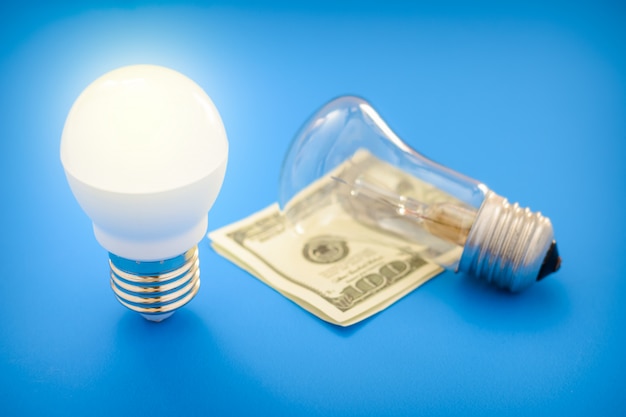 Download Led light bulb lay next to incandescent bulb | Premium Photo