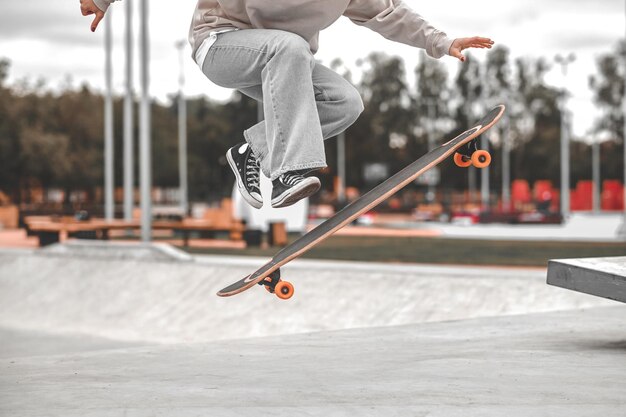 Premium Photo | Legs and skateboard in air at time of jump