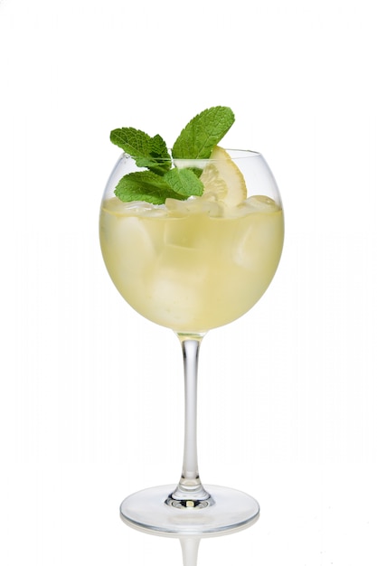 Lemon cocktail with a sparkling wine with ice cubes in wine glass isolated on white Premium Photo