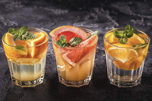 Premium Photo | Lemon, grapefruit, orange homemade cocktail/detox fruit ...