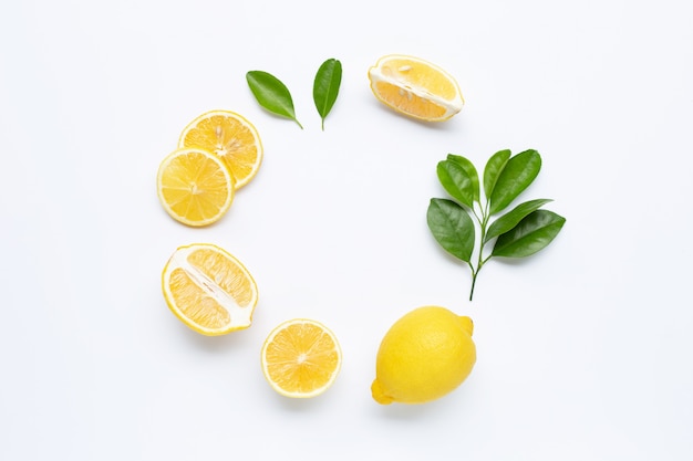 Lemon and slices with leaves isolated on white background framed Premium Photo