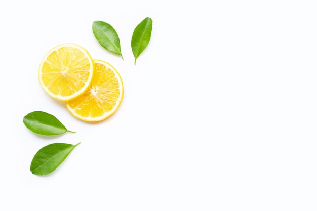 Lemon slices with leaves isolated on white. copy space Premium Photo