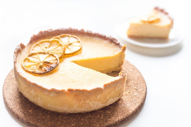 Lemon Tart With Dried Lemons As A Decoration From Above On A White