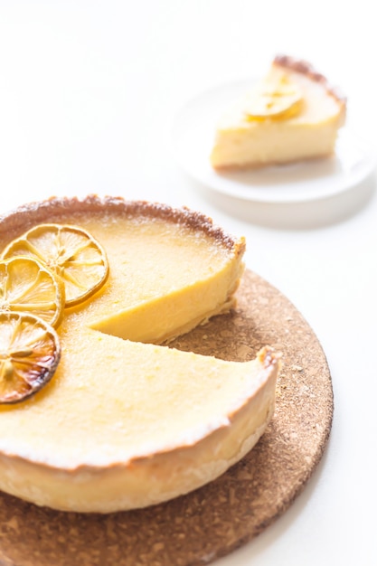 Lemon Tart With Dried Lemons As A Decoration From Above On A White