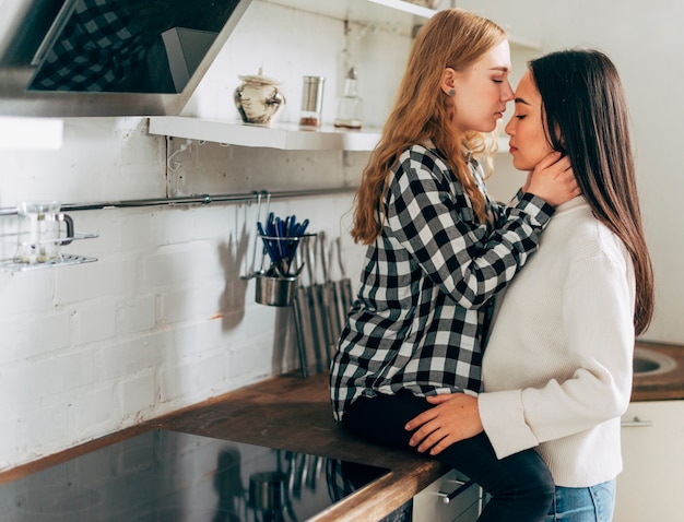 Free Photo Lesbian Couple At Home Embracing