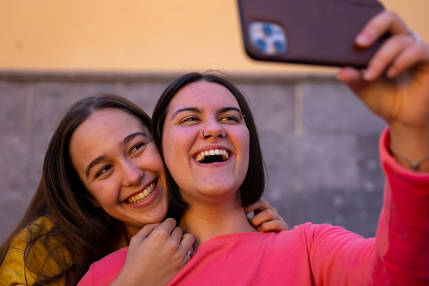 Premium Photo Lesbian Girls Having Fun On The Street With Mobile Phone