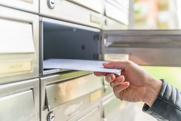 Premium Photo | Letter in the mailbox of an apartment building