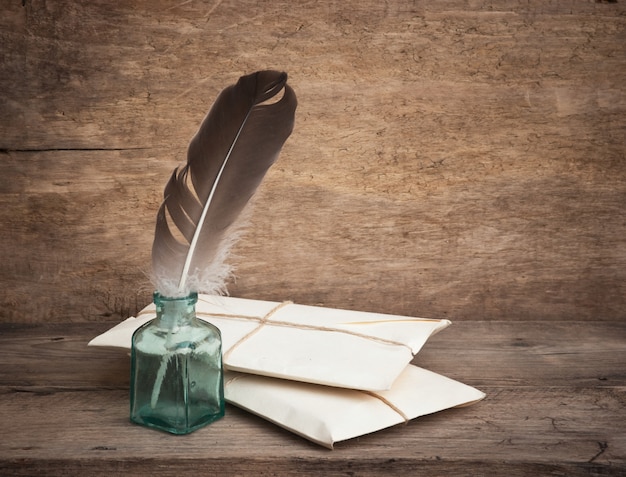 Premium Photo Letter And A Quill In The Inkwell