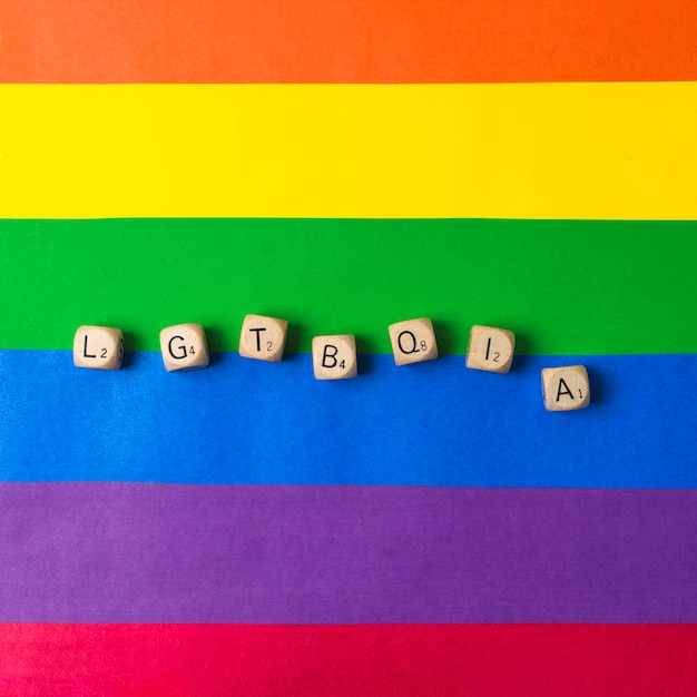 Free Photo Lgbtqia Word Of Dices And Gay Flag