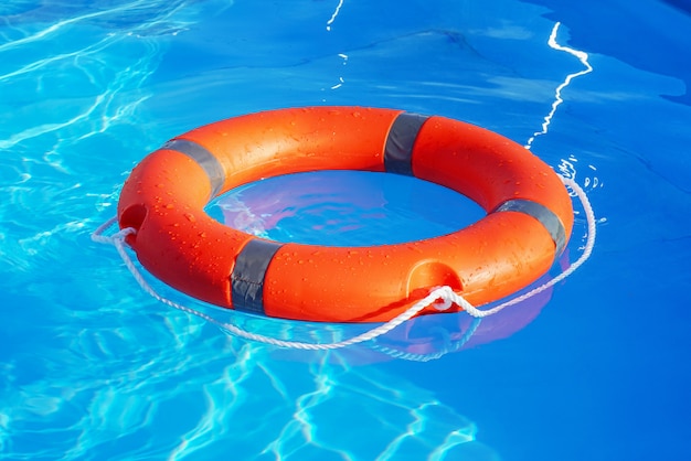 Premium Photo | Lifebuoy pool ring float. life ring in swimming pool.