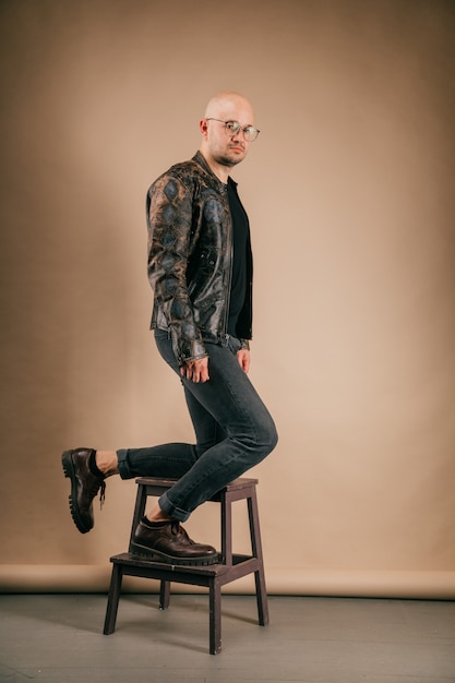 Premium Photo | Lifestyle portrait of fashionable stylish bald man in ...