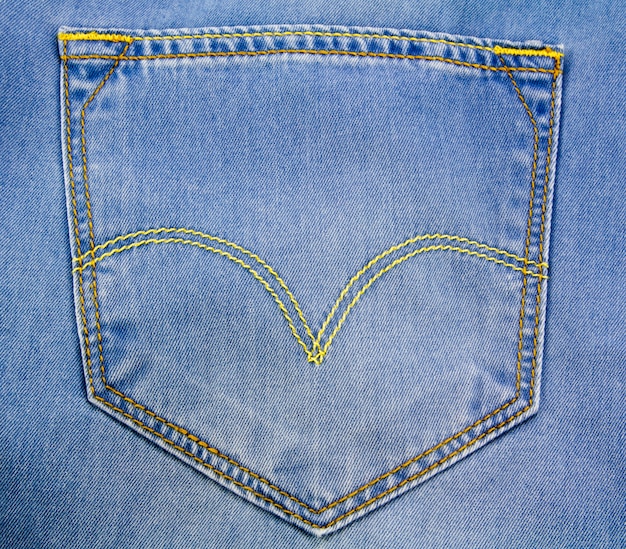 Premium Photo | Light blue jeans back pocket