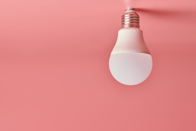 Premium Photo | Light bulb, copyspace. energy saving minimal idea .pink