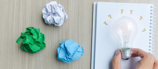 Light bulb or lamp with colorful crumpled paper Premium Photo