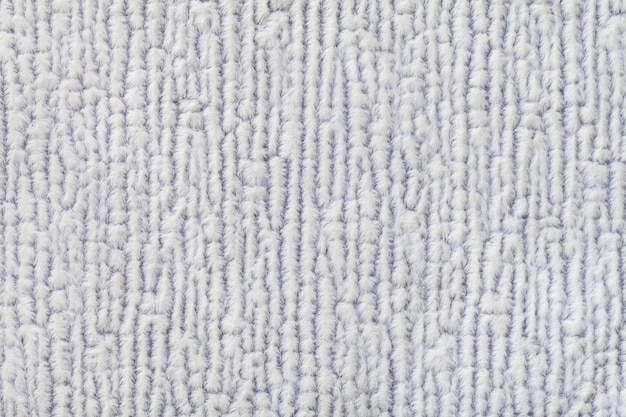 柔らかい フリースの布の明るい灰色のふわふわの背景繊維のクローズアップのテクスチャ プレミアム写真
