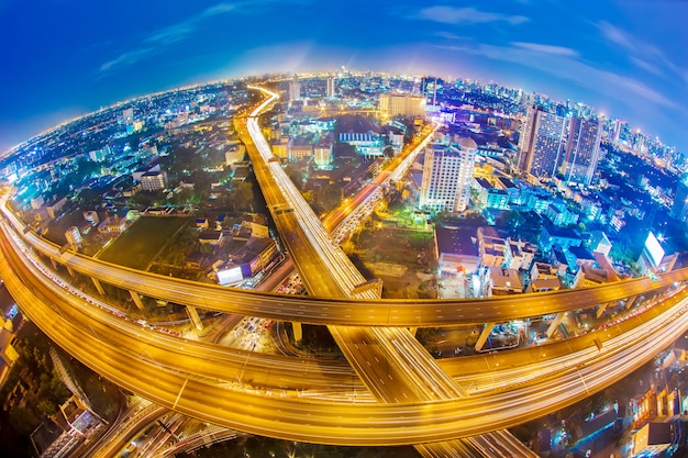 Premium Photo | Light trail on expressway in bangkok city. skyscrapers ...