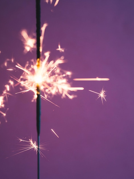 Lighting sparkler stick in studio | Free Photo