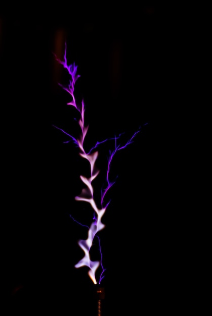 Premium Photo | Lightning on a black background - corona discharge of ...