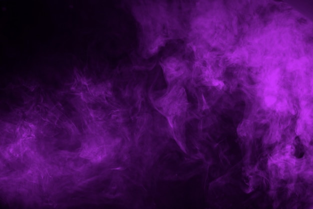 Premium Photo | Lilac smoke on a black background