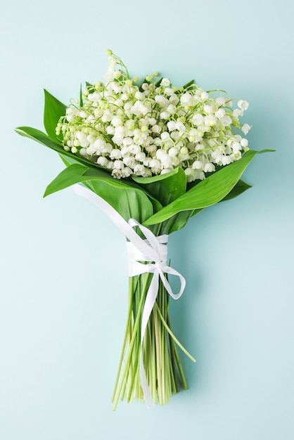 Premium Photo Lily Of The Valley Flowers Bouquet On Pastel Blue Flat Lay Wedding Vertical Orientation