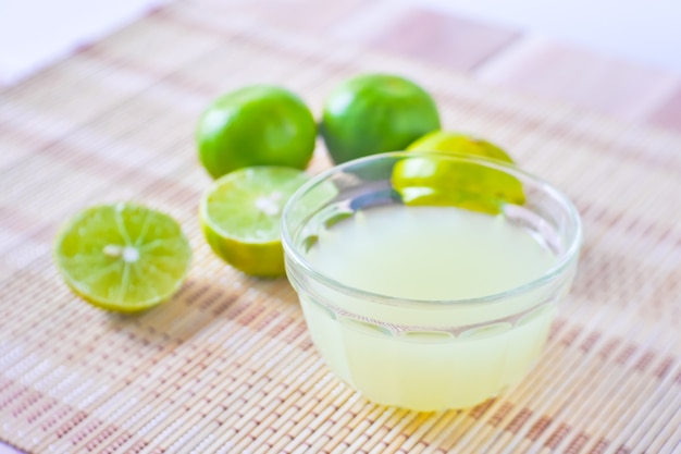 Premium Photo | Lime lemon juice for cooking with close up view